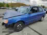 2002 Hyundai Accent GS z VIN KMHCG35C22U161535, wystawiony jako Copart lot #70580195 z przebiegiem 74 007 mil mil oraz Szkoda całkowita • Salvage title. Historia ofert i sprzedaży dostępna na DreamBid. Obrazek 1.