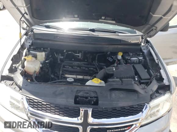 2018 Dodge Journey SE with VIN 3C4PDCAB0JT525021, listed as a Copart auction lot 64236265 with 104,675 mi miles and Salvage title. Bid and sale history available at DreamBid. Image 12.