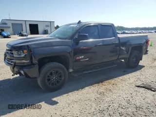 2017 Chevrolet Silverado 1500 LTZ с VIN 1GCVKSEC2HZ131078, выставлен на аукционе Copart как лот 61771675 с пробегом 92 478 миль миль и Списание • Salvage title. История ставок и продаж доступна на DreamBid. Изображение 1.