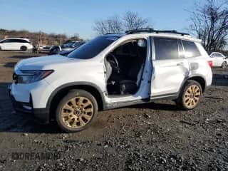 2023 Honda Passport EX-L with VIN 5FNYF8H57PB016515, listed as a Copart auction lot 83520014 with Not provided miles and Salvage title. Bid and sale history available at DreamBid. Image 1.