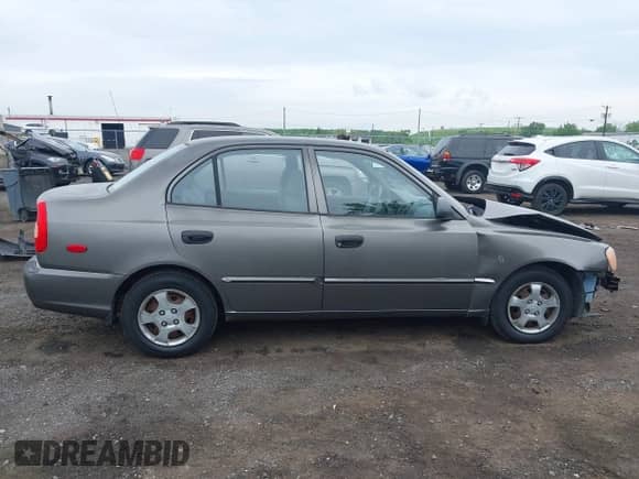 2002 Hyundai Accent GL z VIN KMHCG45C52U372587, wystawiony jako IAAI lot #42244428 z przebiegiem 43 538 mil mil oraz . Historia ofert i sprzedaży dostępna na DreamBid. Obrazek 13.