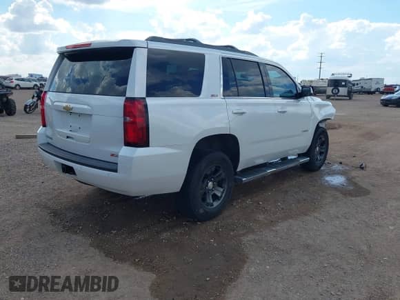 2016 Chevrolet Tahoe LT with VIN 1GNSKBKC0GR377950, listed as a IAAI auction lot 42803552 with 158,653 mi miles and . Bid and sale history available at DreamBid. Image 4.