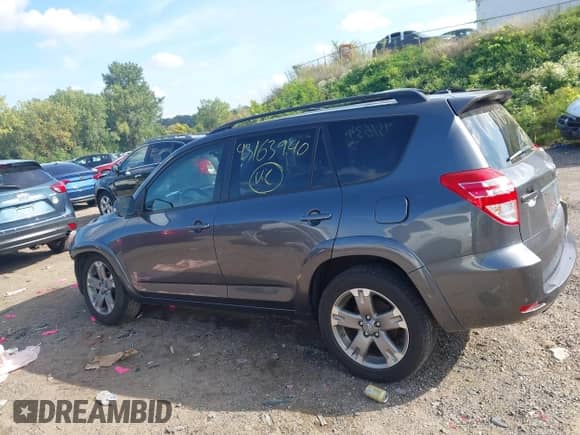 2012 Toyota RAV4 Sport with VIN JTMRF4DV1C5057155, listed as a IAAI auction lot 43163940 with 103,651 mi miles and . Bid and sale history available at DreamBid. Image 14.