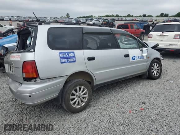 1997 Honda Odyssey with VIN RA21211409, listed as a Copart auction lot 62449015 with Not provided miles and Salvage title. Bid and sale history available at DreamBid. Image 3.