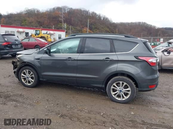 2018 Ford Escape SE with VIN 1FMCU9GD9JUB18987, listed as a IAAI auction lot 40912957 with 110,279 mi miles and . Bid and sale history available at DreamBid. Image 14.