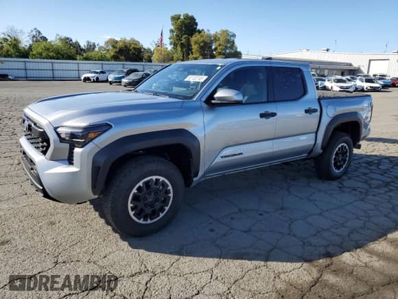 2024 Toyota Tacoma TRD Off Road with VIN 3TMLB5JN8RM000837, listed as a Copart auction lot 82183745 with 14,184 mi miles and Salvage title. Bid and sale history available at DreamBid. Image 1.