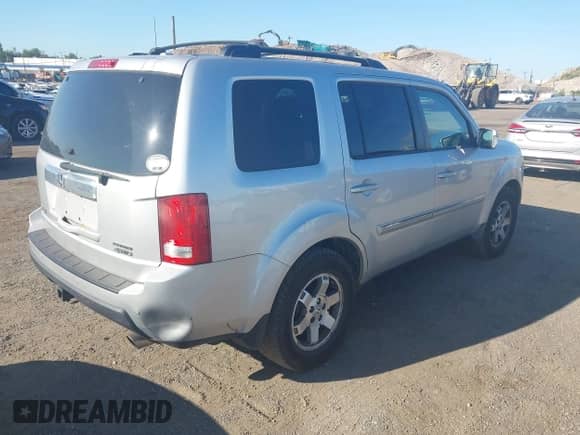 2009 Honda Pilot Touring with VIN 5FNYF488X9B023366, listed as a IAAI auction lot 43068300 with 210,590 mi miles and . Bid and sale history available at DreamBid. Image 4.