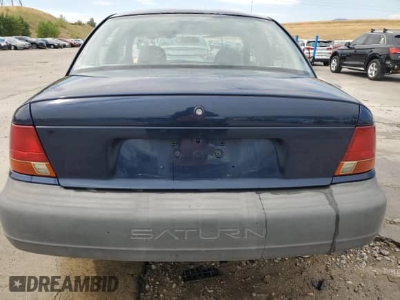 1999 Saturn SL z VIN 1G8ZF5281XZ122985, wystawiony jako Copart lot #67490155 z przebiegiem 139 416 mil mil oraz Szkoda całkowita • Salvage title. Historia ofert i sprzedaży dostępna na DreamBid. Obrazek 6.
