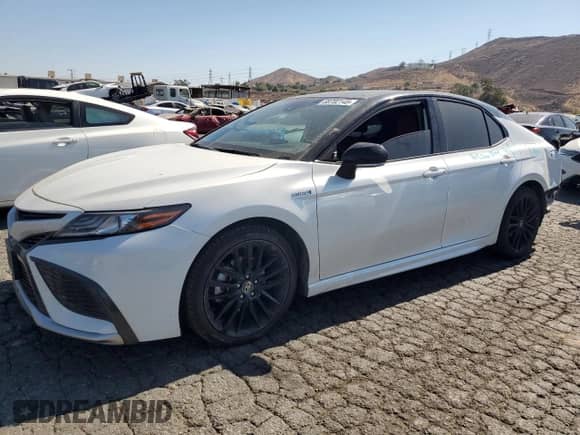2021 Toyota Camry Hybrid XSE with VIN 4T1K31AK4MU028027, listed as a Copart auction lot 69702145 with 84,116 mi miles and Salvage title. Bid and sale history available at DreamBid. Image 1.