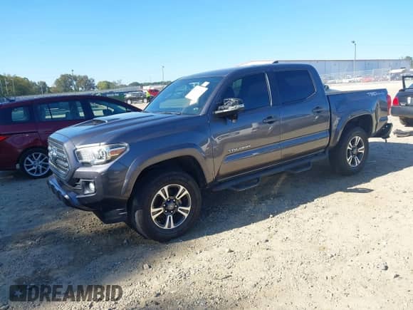 2016 Toyota Tacoma SR5 z VIN 5TFAZ5CN1GX009418, wystawiony jako IAAI lot #43365469 z przebiegiem 180 719 mil mil oraz . Historia ofert i sprzedaży dostępna na DreamBid. Obrazek 2.