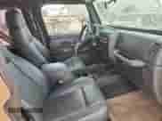 2003 Jeep Wrangler X z VIN 1J4FA39S33P356428, wystawiony jako Copart lot #70285135 z przebiegiem 147 788 mil mil oraz Szkoda całkowita • Salvage title. Historia ofert i sprzedaży dostępna na DreamBid. Obrazek 10.