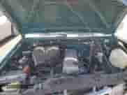 1996 Nissan Frontier XE with VIN 1N6SD11S7TC376391, listed as a Copart auction lot 58258525 with 121,702 mi miles and Salvage title. Bid and sale history available at DreamBid. Image 11.