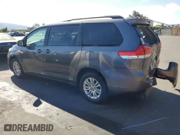 2012 Toyota Sienna XLE AAS with VIN 5TDYK3DC7CS275515, listed as a Copart auction lot 63839725 with 149,968 mi miles and Salvage title. Bid and sale history available at DreamBid. Image 2.