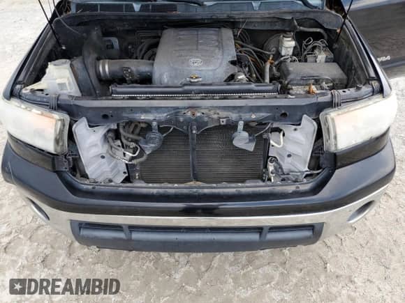 2013 Toyota Tundra z VIN 5TFUM5F1XDX046077, wystawiony jako Copart lot #65893365 z przebiegiem 240 153 mil mil oraz Szkoda całkowita • Salvage title. Historia ofert i sprzedaży dostępna na DreamBid. Obrazek 11.