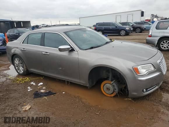 2014 Chrysler 300 C with VIN 2C3CCAKG1EH200994, listed as a Copart auction lot 85164505 with 182,228 mi miles and Salvage title. Bid and sale history available at DreamBid. Image 4.