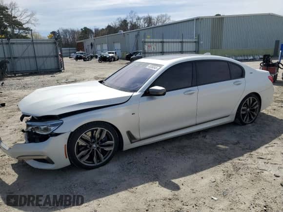 2018 BMW 7 Series M760i xDrive с VIN WBA7H6C53JG614967, выставлен на аукционе Copart как лот 49269345 с пробегом 83 872 миль миль и Списание • Salvage title. История ставок и продаж доступна на DreamBid. Изображение 1.