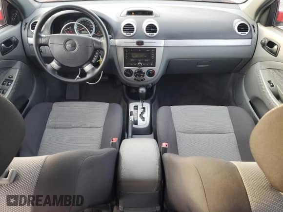 2007 Chevrolet Optra с VIN KL1JK85Z67K649358, выставлен на аукционе Copart как лот 77948224 с пробегом 143 525 миль миль и Чистый • Clean title. История ставок и продаж доступна на DreamBid. Изображение 8.