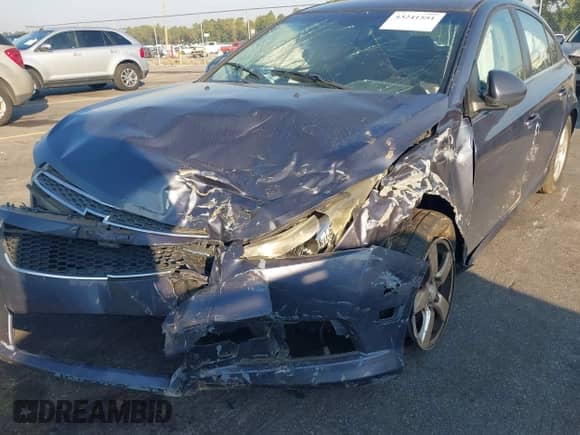 2014 Chevrolet Cruze 1LT z VIN 1G1PC5SB7E7144699, wystawiony jako IAAI lot #43241551 z przebiegiem 156 411 mil mil oraz . Historia ofert i sprzedaży dostępna na DreamBid. Obrazek 6.