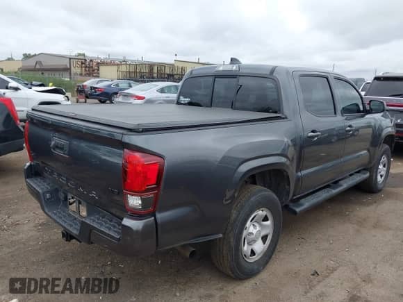 2023 Toyota Tacoma SR with VIN 3TMCZ5ANXPM538495, listed as a IAAI auction lot 42993850 with 41,728 mi miles and . Bid and sale history available at DreamBid. Image 4.