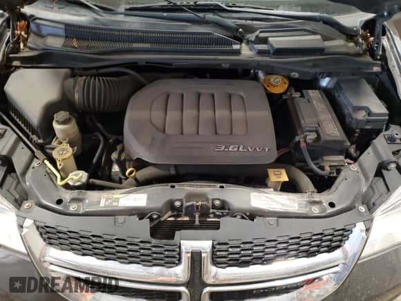 2018 Dodge Grand Caravan SE z VIN 2C4RDGBG5JR312871, wystawiony jako Copart lot #69593385 z przebiegiem 159 455 mil mil oraz Czysty tytuł • Clean title. Historia ofert i sprzedaży dostępna na DreamBid. Obrazek 12.