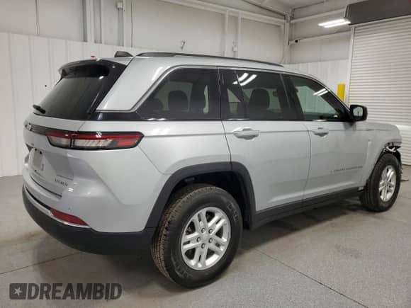 2023 Jeep Grand Cherokee Laredo with VIN 1C4RJHAG2PC673380, listed as a Copart auction lot 70686625 with 59,170 mi miles and Clean title. Bid and sale history available at DreamBid. Image 3.