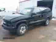 2002 Chevrolet Blazer LS z VIN 1GNDT13W92K170614, wystawiony jako IAAI lot #41745723 z przebiegiem 119 571 mil mil oraz . Historia ofert i sprzedaży dostępna na DreamBid. Obrazek 2.