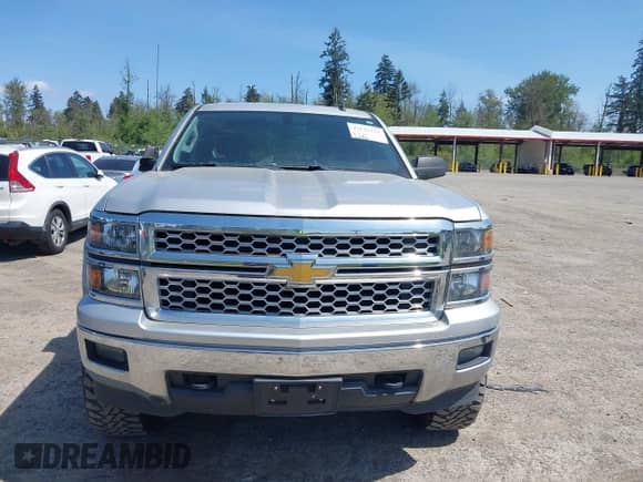 2014 Chevrolet Silverado 1500 LT with VIN 3GCUKREH0EG399090, listed as a IAAI auction lot 42142324 with 104,226 mi miles and . Bid and sale history available at DreamBid. Image 12.