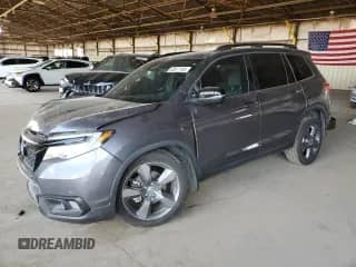 2020 Honda Passport Touring with VIN 5FNYF7H90LB003869, listed as a Copart auction lot 63877165 with 57,387 mi miles and Salvage title. Bid and sale history available at DreamBid. Image 1.