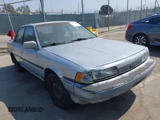 1988 Toyota Camry LE z VIN JT2SV22EXJ3305934, wystawiony jako IAAI lot #42737343 z przebiegiem 256 096 mil mil oraz . Historia ofert i sprzedaży dostępna na DreamBid. Obrazek 1.