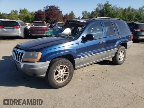 2002 Jeep Grand Cherokee Laredo with VIN 1J4GW48S82C128797, listed as a Copart auction lot 64885725 with 167,701 mi miles and Non repairable. Bid and sale history available at DreamBid. Image 1.