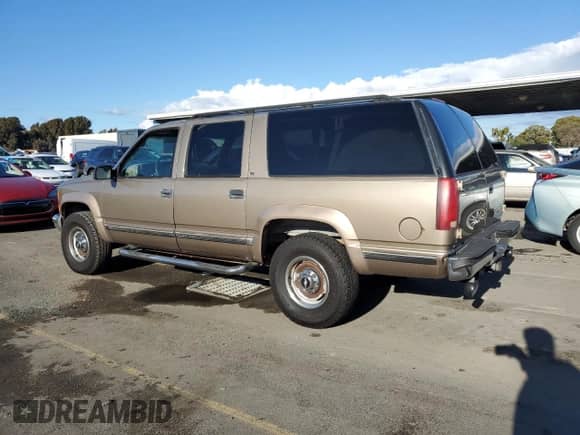 1996 Chevrolet Suburban с VIN 3GNGK26JXTG107228, выставлен на аукционе Copart как лот 44741195 с пробегом 172 053 миль миль и Чистый • Clean title. История ставок и продаж доступна на DreamBid. Изображение 2.