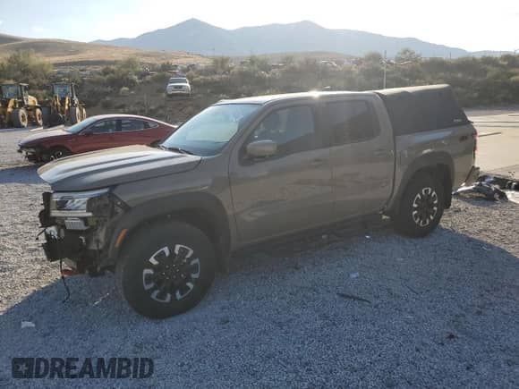 2024 Nissan Frontier Pro-4X with VIN 1N6ED1EK4RN622270, listed as a Copart auction lot 81142545 with 6,749 mi miles and Salvage title. Bid and sale history available at DreamBid. Image 1.