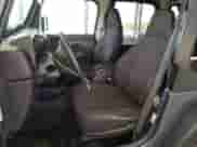 2002 Jeep Wrangler Sport z VIN 1J4FA49S22P715529, wystawiony jako Copart lot #89871905 z przebiegiem 133 220 mil mil oraz Szkoda całkowita • Salvage title. Historia ofert i sprzedaży dostępna na DreamBid. Obrazek 7.