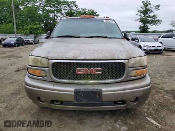 2002 GMC Sierra 1500 Denali z VIN 2GTFK69U321309689, wystawiony jako Copart lot #60267695 z przebiegiem 351 508 mil mil oraz Czysty tytuł • Clean title. Historia ofert i sprzedaży dostępna na DreamBid. Obrazek 5.