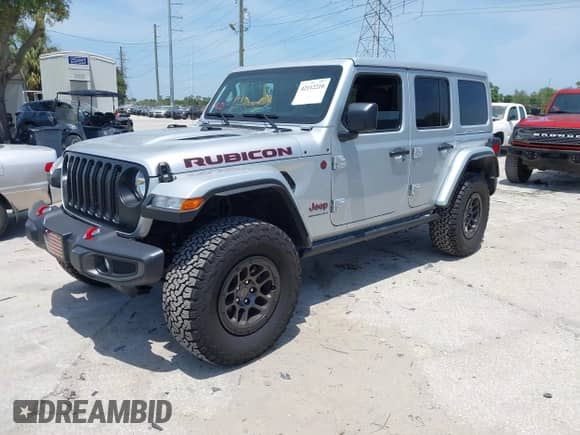 2023 Jeep Wrangler Rubicon with VIN 1C4JJXFG0PW522651, listed as a IAAI auction lot 42112210 with 7,744 mi miles and . Bid and sale history available at DreamBid. Image 2.
