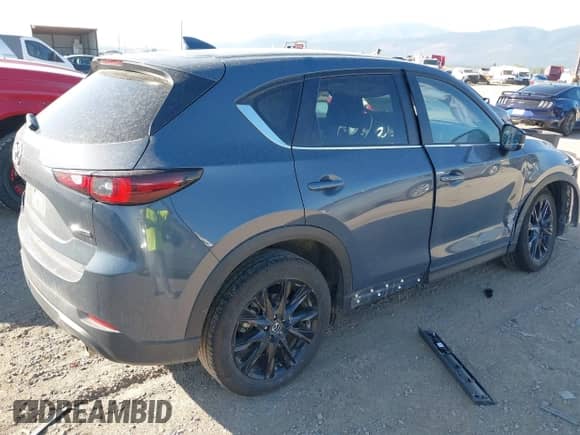 2025 Mazda CX-5 S Carbon Edition z VIN JM3KFBCM8S0587267, wystawiony jako IAAI lot #43018737 z przebiegiem 19 192 mil mil oraz . Historia ofert i sprzedaży dostępna na DreamBid. Obrazek 4.