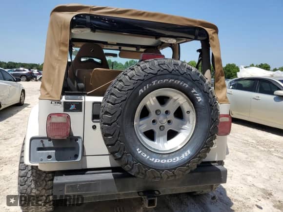 2001 Jeep Wrangler Sahara with VIN 1J4FA59S81P321490, listed as a Copart auction lot 57320005 with 180,959 mi miles and Salvage title. Bid and sale history available at DreamBid. Image 6.
