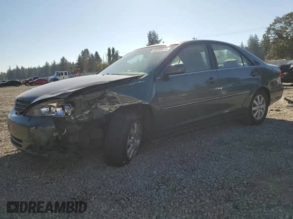 2002 Toyota Camry XLE with VIN JTDBF30K320043468, listed as a Copart auction lot 82289975 with 235,912 mi miles and Salvage title. Bid and sale history available at DreamBid. Image 1.