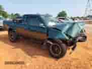 2000 Nissan Frontier XE with VIN 1N6ED26TXYC332543, listed as a Copart auction lot 64014015 with 186,261 mi miles and Salvage title. Bid and sale history available at DreamBid. Image 4.