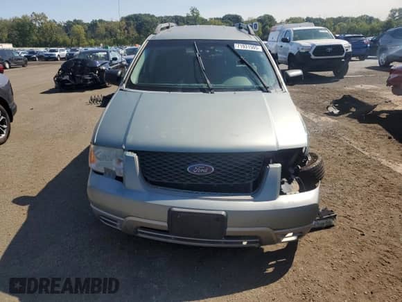 2005 Ford Freestyle SE with VIN 1FMZK01145GA23073, listed as a Copart auction lot 71931505 with 215,349 mi miles and Salvage title. Bid and sale history available at DreamBid. Image 5.