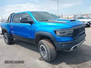 2022 Ram 1500 TRX with VIN 1C6SRFU96NN267610, listed as a IAAI auction lot 43033854 with 19,475 mi miles and . Bid and sale history available at DreamBid. Image 1.