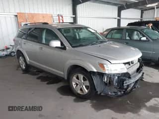 2012 Dodge Journey SXT z VIN 3C4PDDBG1CT205905, wystawiony jako IAAI lot #43351815 z przebiegiem 148 244 mil mil oraz . Historia ofert i sprzedaży dostępna na DreamBid. Obrazek 1.