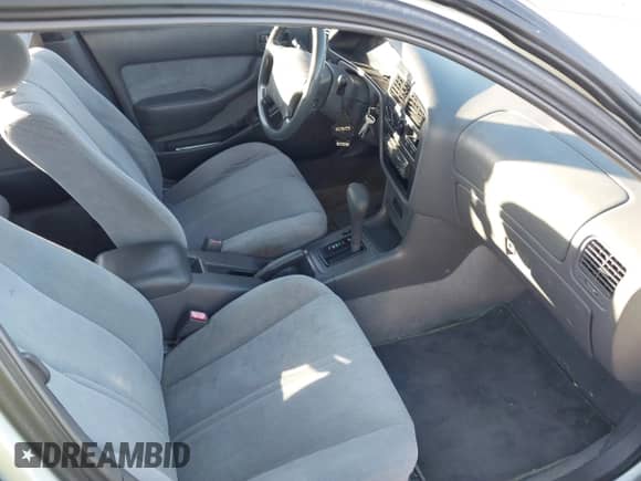 1995 Toyota Camry LE z VIN 4T1SK12E7SU554788, wystawiony jako IAAI lot #43498330 z przebiegiem 255 825 mil mil oraz . Historia ofert i sprzedaży dostępna na DreamBid. Obrazek 5.