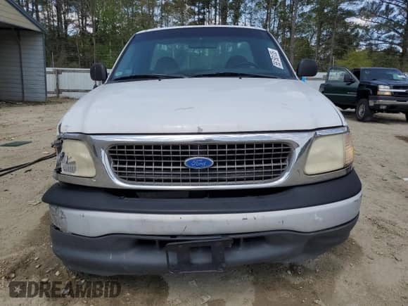 2000 Ford F-150 XL z VIN 1FTRF17W9YNA69175, wystawiony jako Copart lot #55150135 z przebiegiem 225 373 mil mil oraz Szkoda całkowita • Salvage title. Historia ofert i sprzedaży dostępna na DreamBid. Obrazek 5.