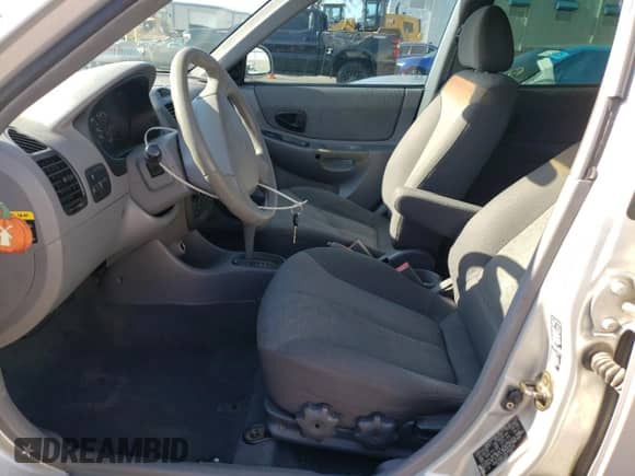 2003 Hyundai Accent GL z VIN KMHCG45C13U494378, wystawiony jako Copart lot #63713375 z przebiegiem 114 772 mil mil oraz Szkoda całkowita • Salvage title. Historia ofert i sprzedaży dostępna na DreamBid. Obrazek 7.