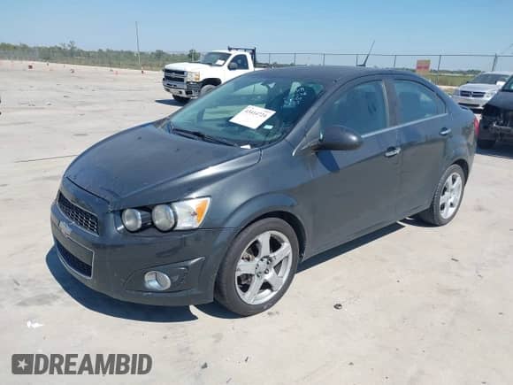 2014 Chevrolet Sonic LTZ with VIN 1G1JE5SB6E4203338, listed as a IAAI auction lot 43414724 with 126,365 mi miles and . Bid and sale history available at DreamBid. Image 2.