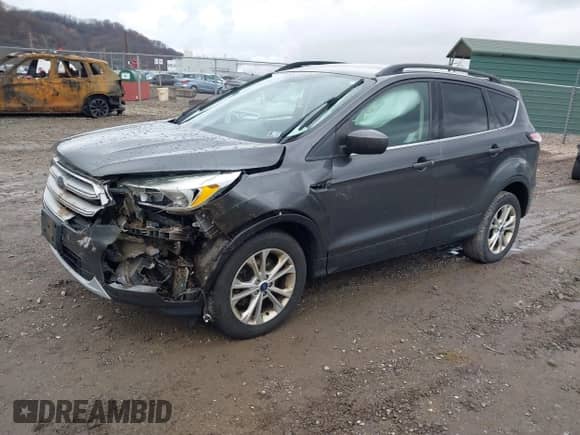 2018 Ford Escape SE with VIN 1FMCU9GD9JUB18987, listed as a IAAI auction lot 40912957 with 110,279 mi miles and . Bid and sale history available at DreamBid. Image 2.