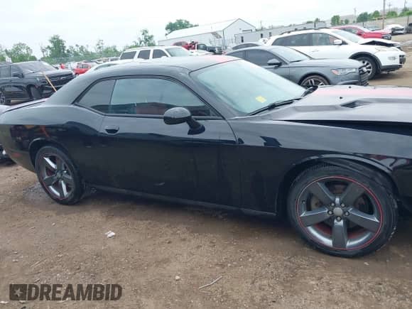 2013 Dodge Challenger SXT with VIN 2C3CDYAG1DH581784, listed as a IAAI auction lot 42263476 with 107,341 mi miles and . Bid and sale history available at DreamBid. Image 13.