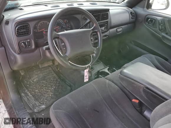 2000 Dodge Dakota Sport с VIN 1B7GL22NXYS695274, выставлен на аукционе Copart как лот 52212485 с пробегом 105 592 миль миль и Списание • Salvage title. История ставок и продаж доступна на DreamBid. Изображение 8.