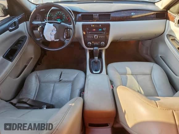 2012 Chevrolet Impala LTZ with VIN 2G1WC5E35C1257576, listed as a Copart auction lot 82001785 with 174,047 mi miles and Salvage title. Bid and sale history available at DreamBid. Image 8.